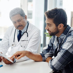 Person receiving medical diagnosis from doctor