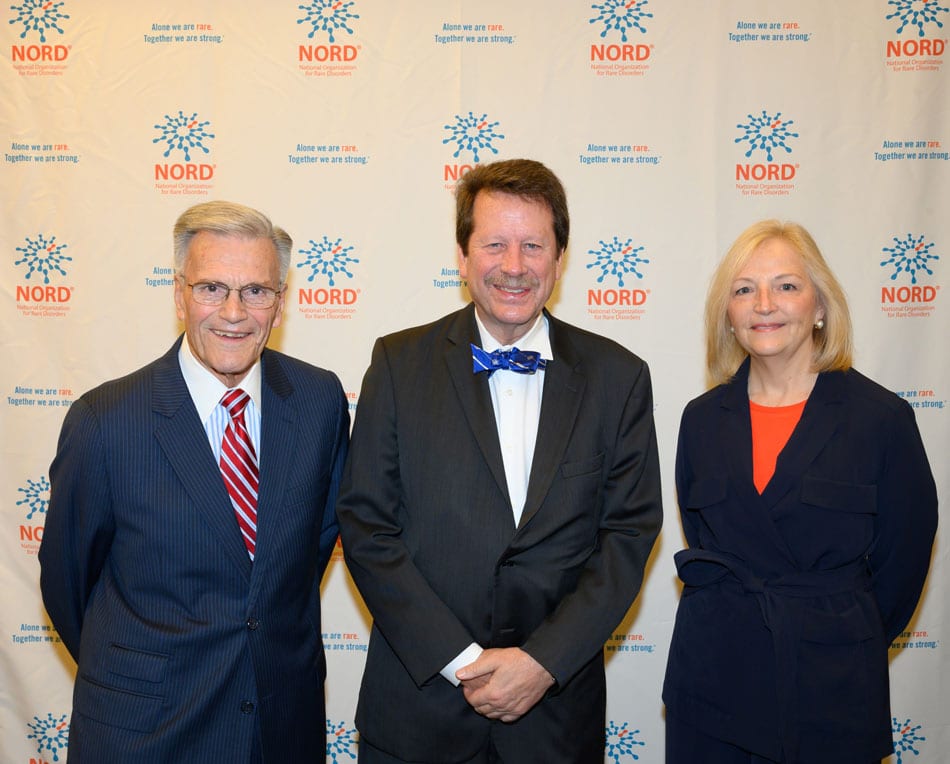 Three people stand in front of the NORD logo - Peter Saltonstall, Robert Califf, and Pam Gavin