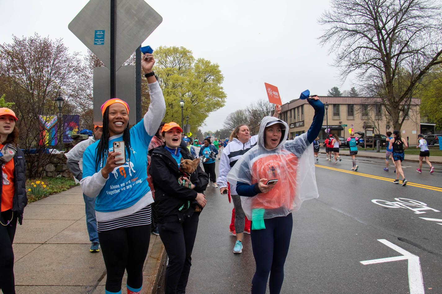 Boston Marathon participants running together.