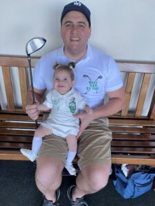 Steve and Hannah in matching golf shirts Stacey made.