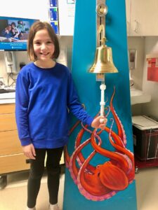 Jane ringing the bell at her cancer center