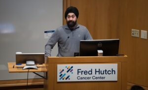 Dr. Taran gujral speaking at a podium