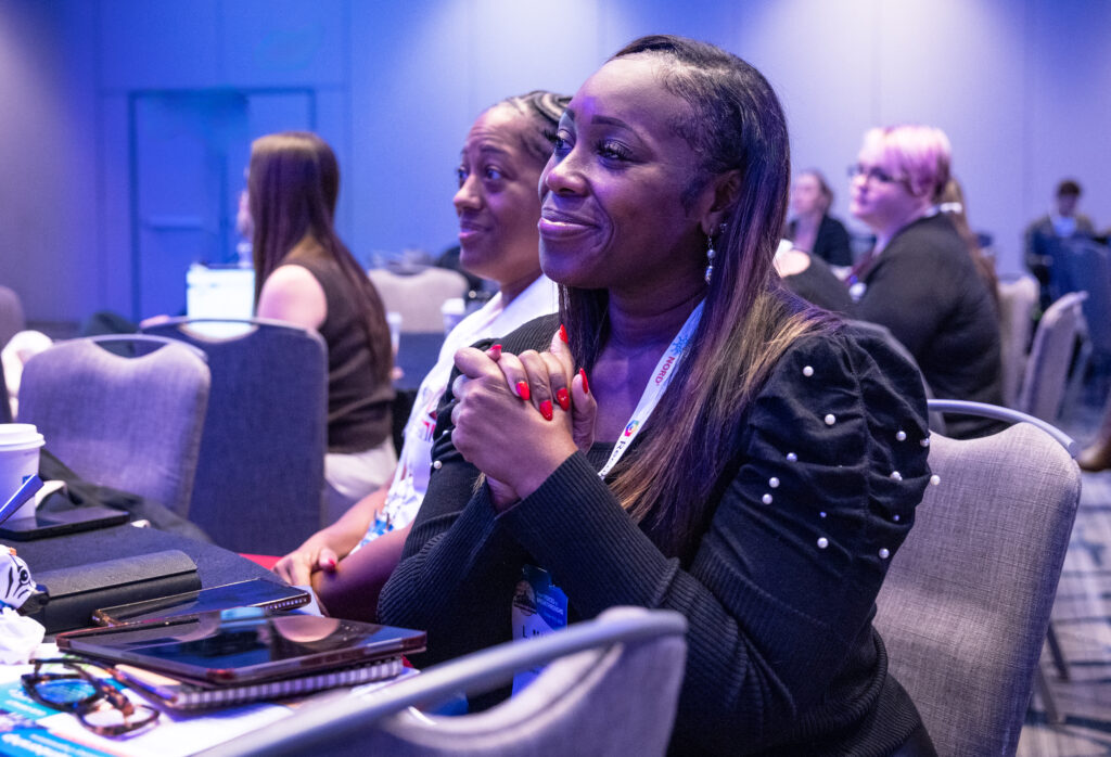 Audience members moved by a NORD Breakthrough Summit speaker