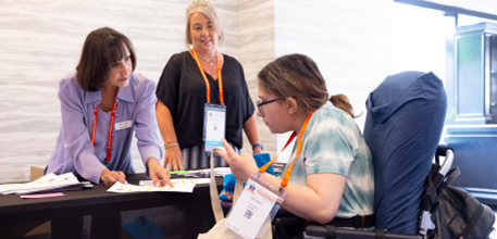 Jill Pollander assisting attendees at NORD Living Rare, Living Stronger